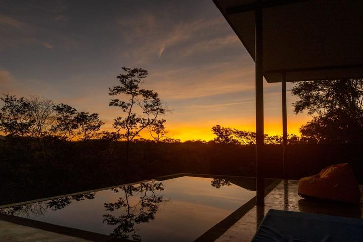 Sunset over an infinity pool