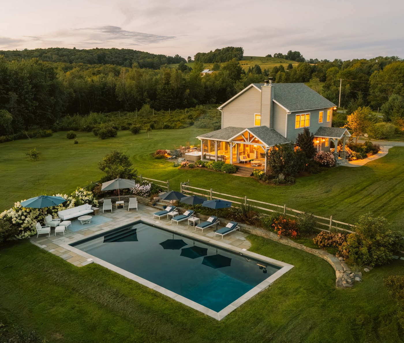 Estate home with a pool on a large property, seen from above